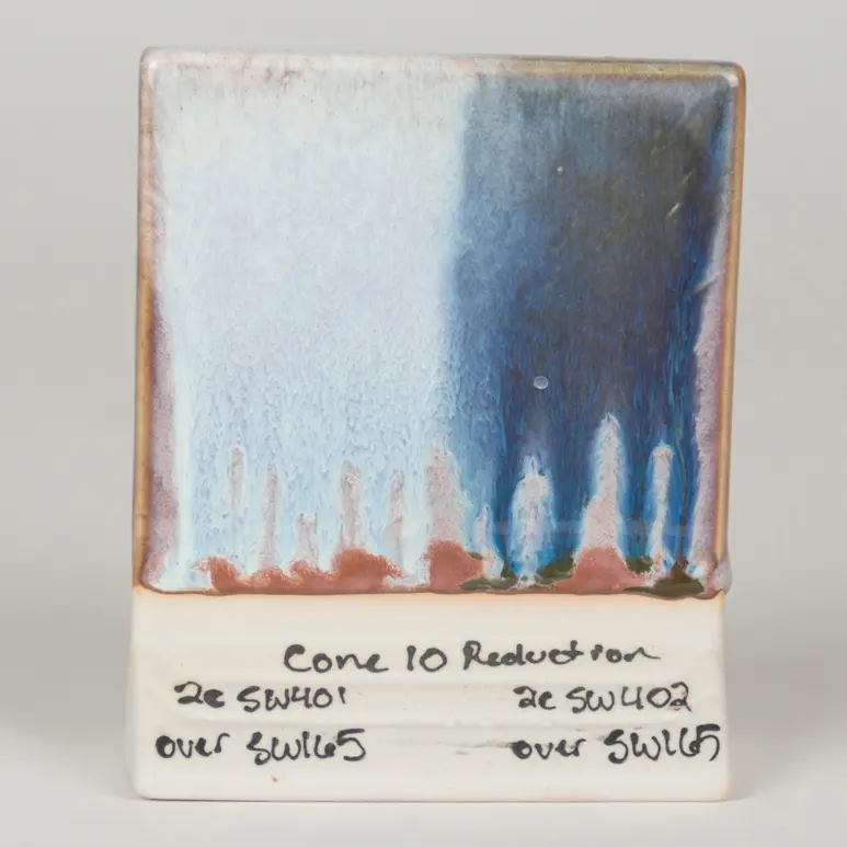 Lavender Mist Under SW-401 Light Flux (left) and SW-402 Dark Flux (right), Cone 10