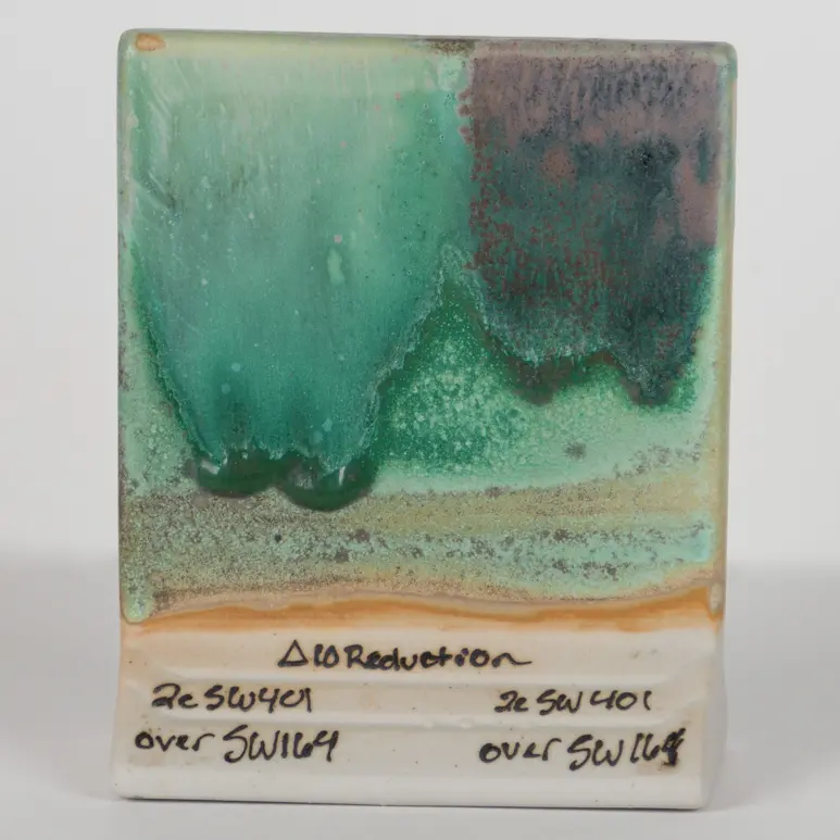 Satin Patina Under SW-401 Light Flux (left) and SW-402 Dark Flux (right), Cone 10